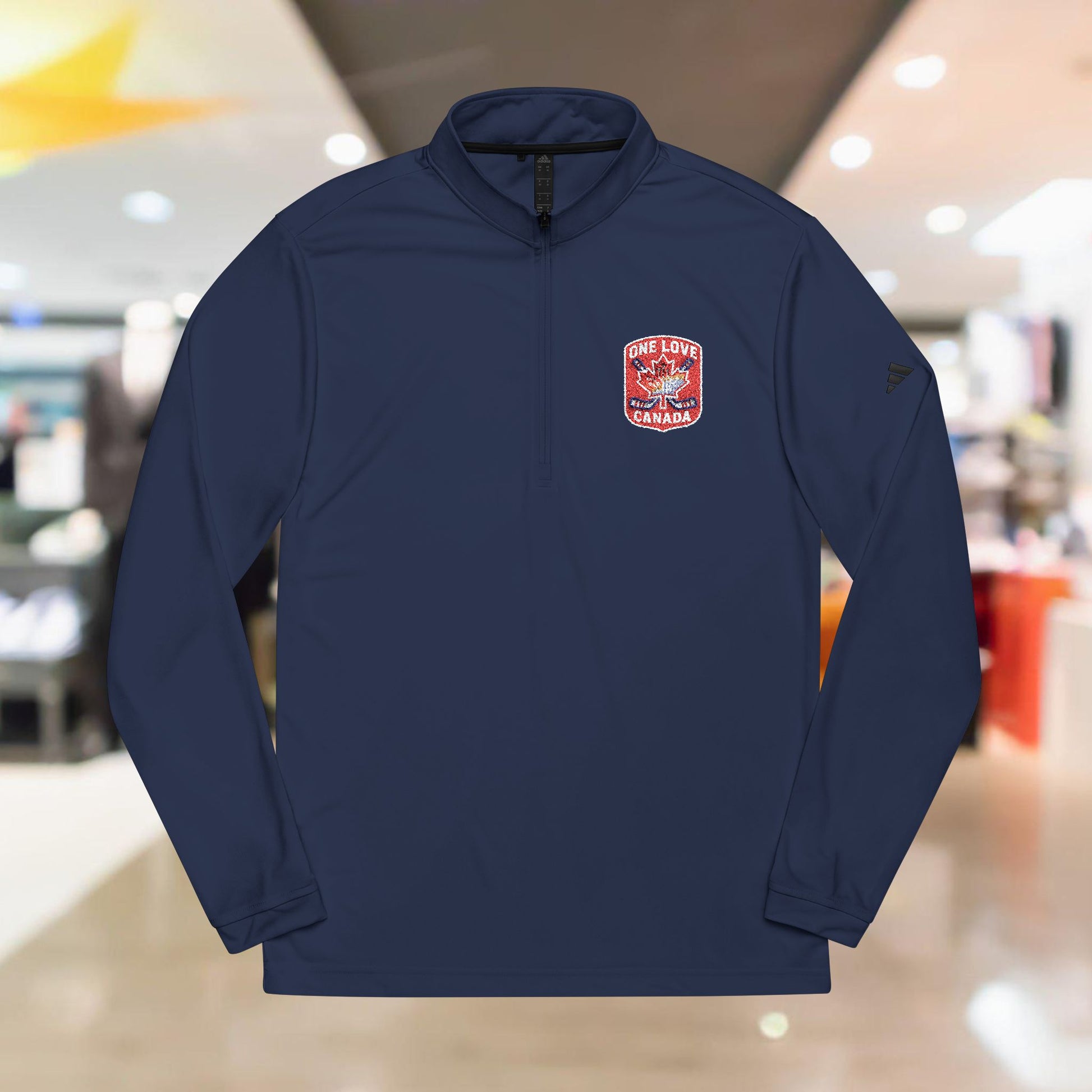 Adidas® Quarter-Zip Pullover with Embroidered Design - OneLoveCanada